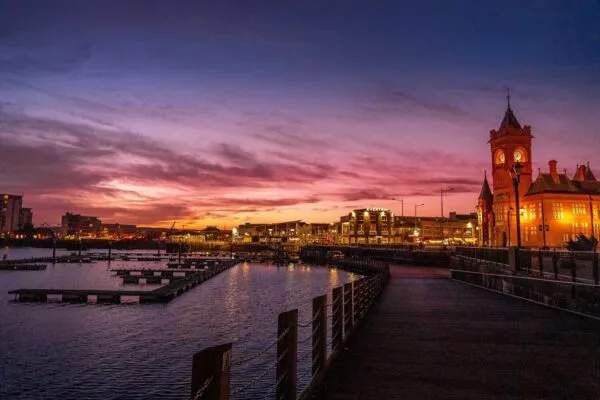 purple sunset at Cardiff Bay with the Cathedral lit up in lights
