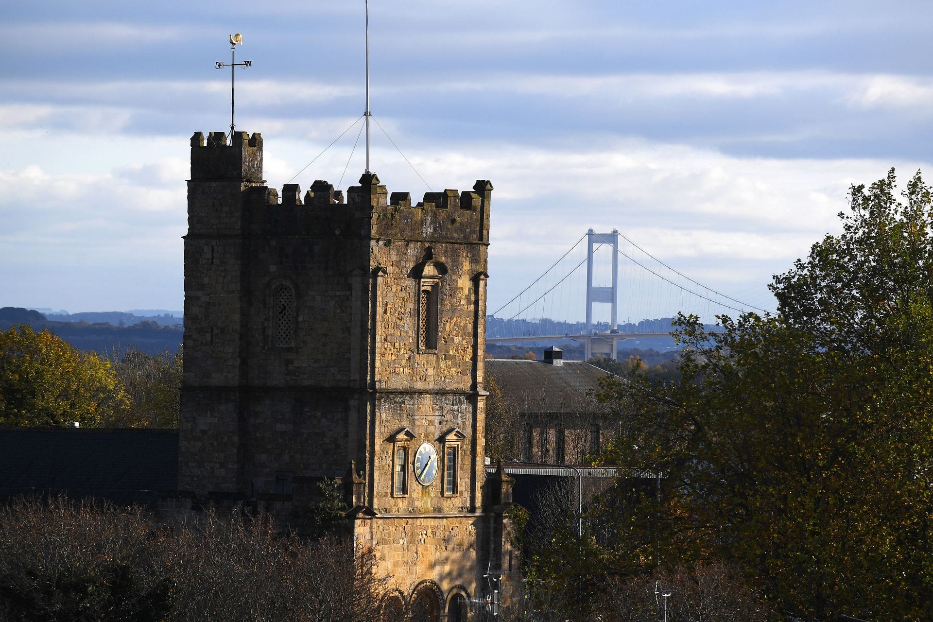 The Great Tower of Chepstow Castle, its Norman stonework and chevron-decorated doorway visible, built with stone shipped from Caen in Normandy around 1090.