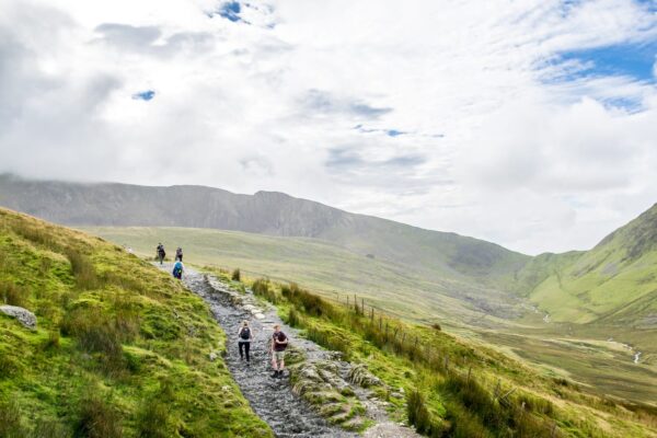 Hikers using the Llanberis Path up mount Snowdon which is one of the most popular destinations in Wales