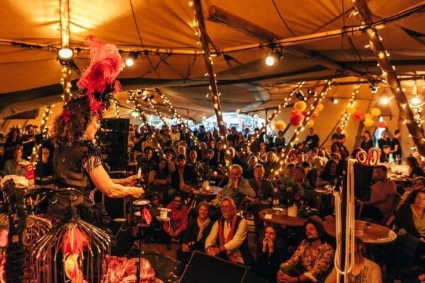 Audience watching a cabaret performance at how the light gets in festival