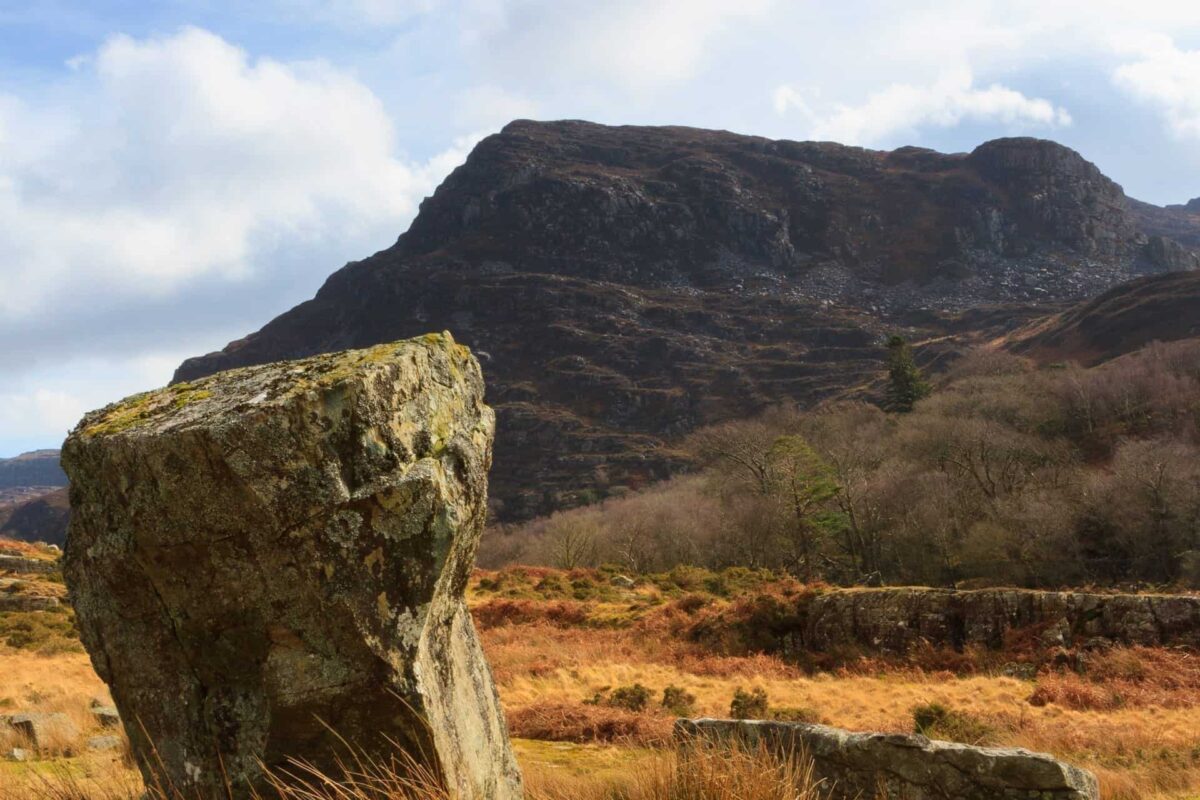 The Rhinogydd or Rhinog mountain range east of Harlech in North Wales with glacial erratic boulders deposited during last ice age in the foreground and Rhinog Fawr in the distance
