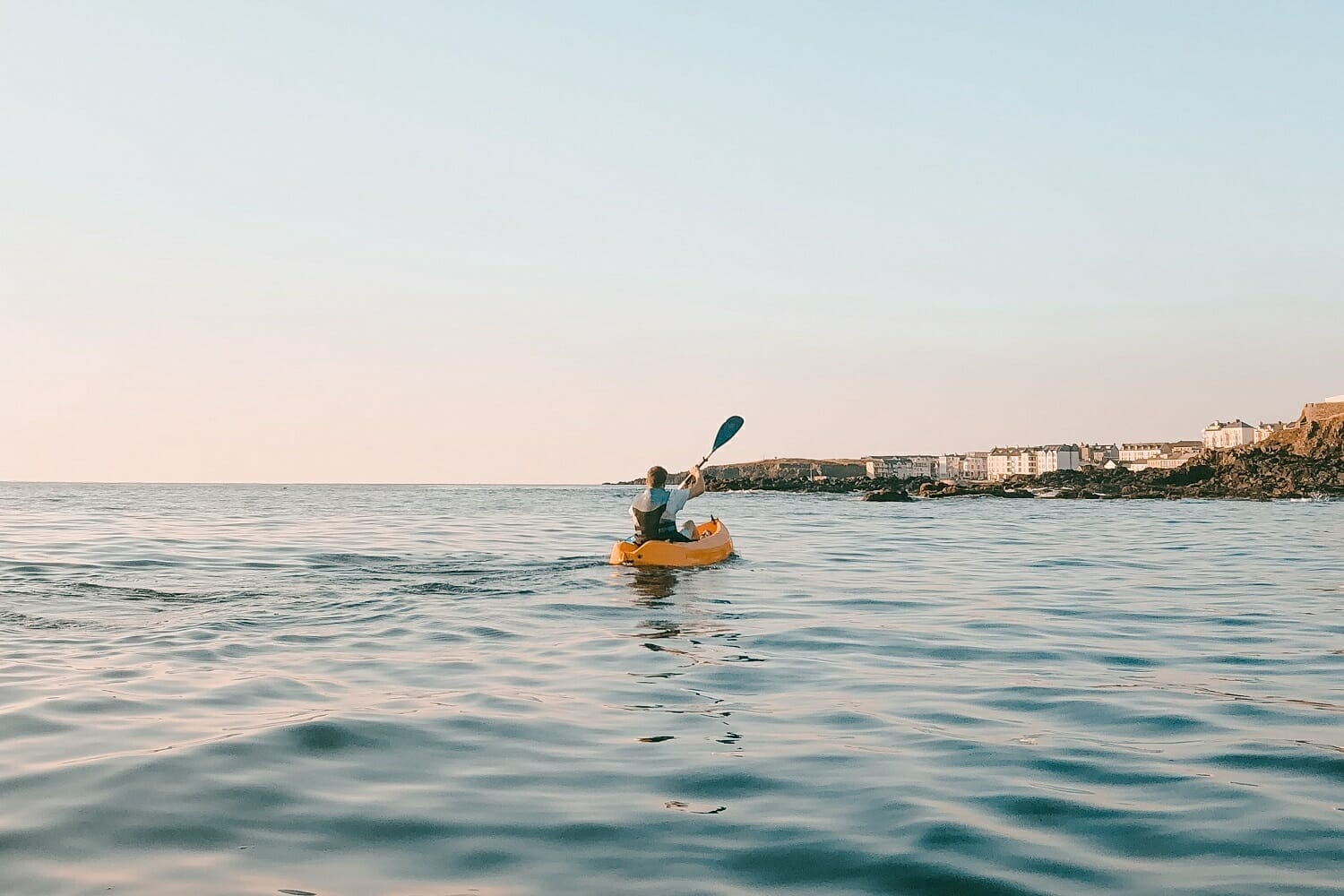 Sea kayaker wearing life jacket