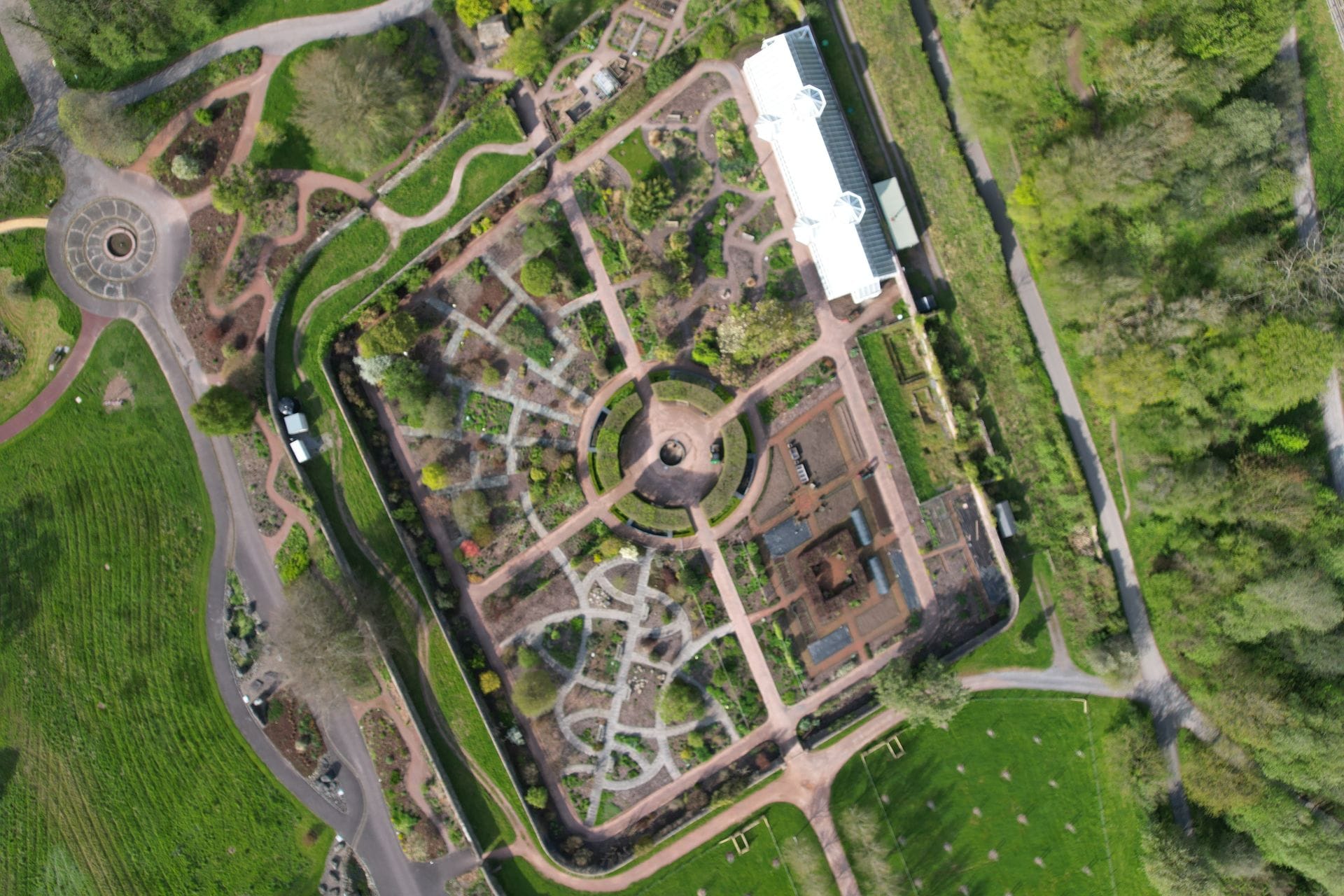 Scenic outdoor water features, lakes, and beautifully landscaped grounds surrounding the National Botanic Garden of Wales in Carmarthenshire.