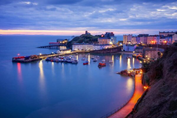 Tenby harbour with colourful houses and fishing boats, Pembrokeshire, West Wales