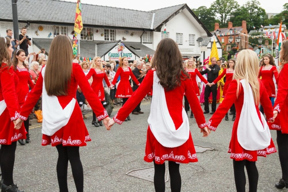 Llangollen Wales UK - Irish female folk dancers at the International Musical Eisteddfod street parade in Llangollen celebrating folk music and dance from around the world