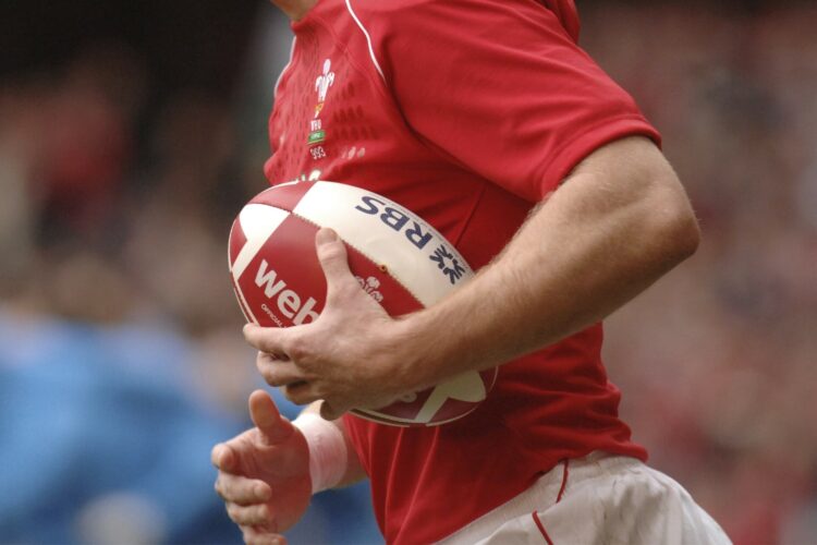 close up of welsh rugby player holding the ball during the Seix Nations rugby match Wlaes vs Italy at the Millennium stadium, in Cardiff.